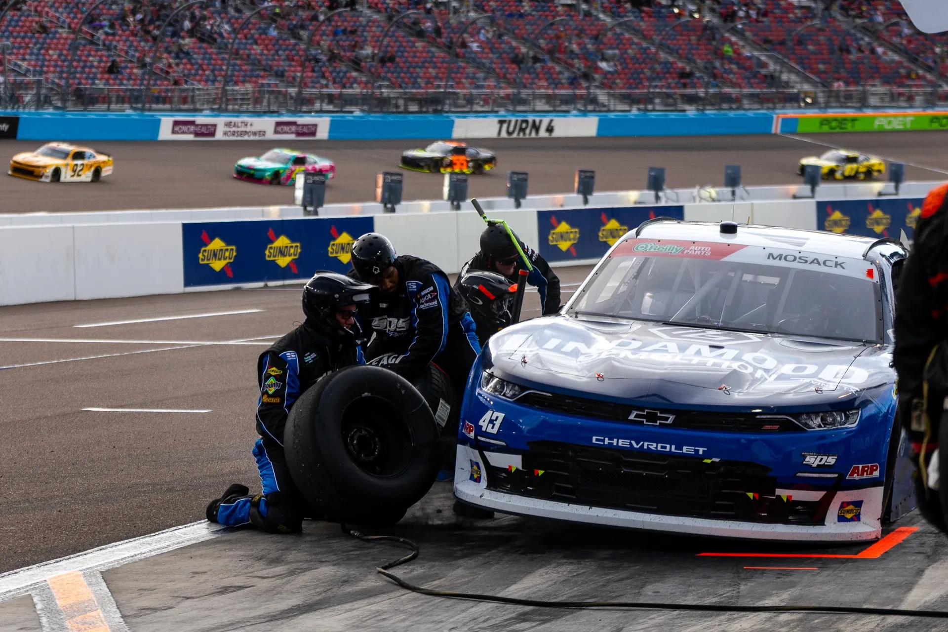 SPS crew members service the No. 43 Lindamood Chevrolet on pit road at Phoenix Raceway.