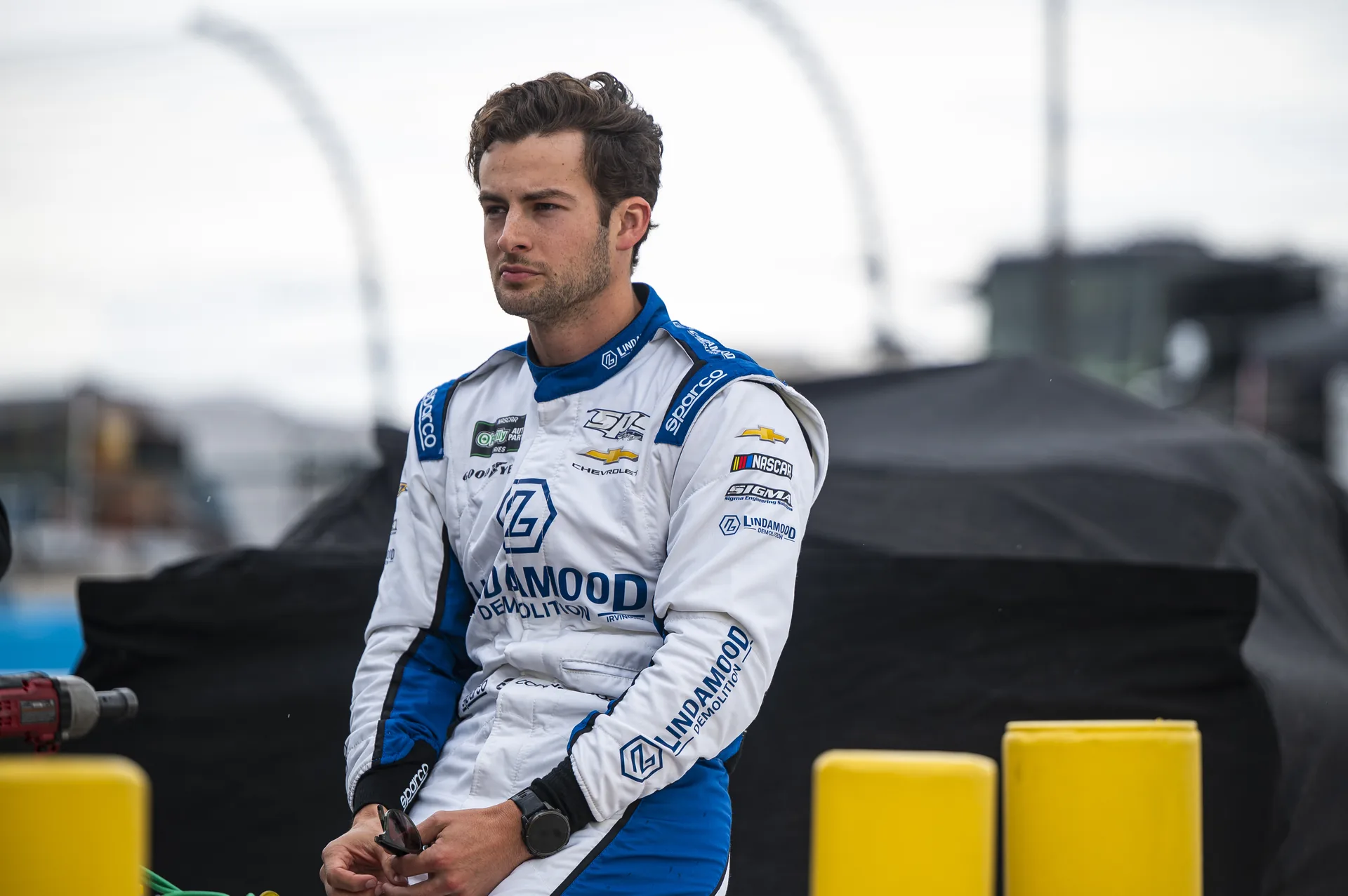 Connor Mosack in his white and blue Lindamood racing suit at Phoenix Raceway.